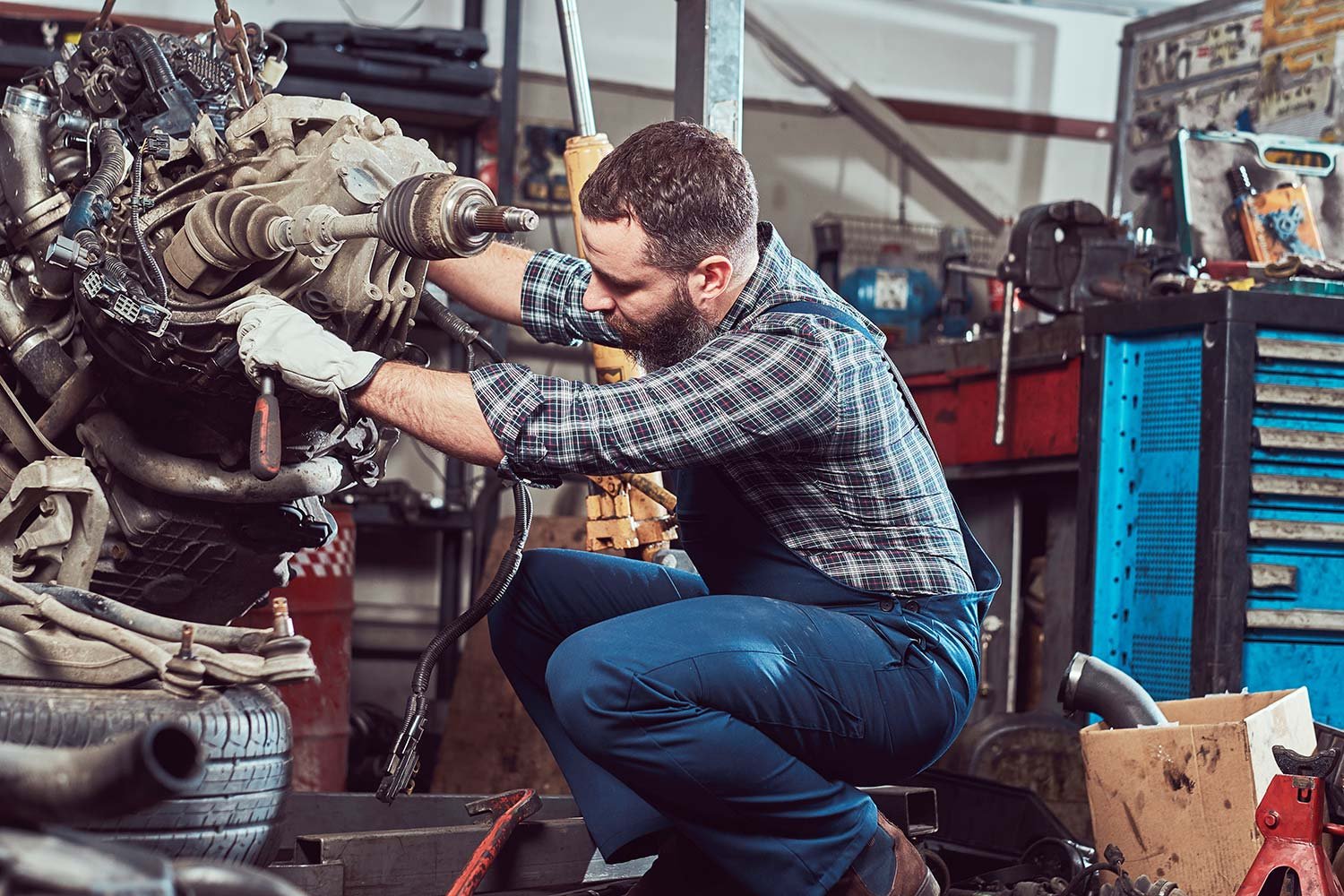 brutal-tattooed-mechanic-repairs-the-car-engine-in-small.jpg